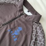 Long sleeve 1/4 zipper, collar detail with logo